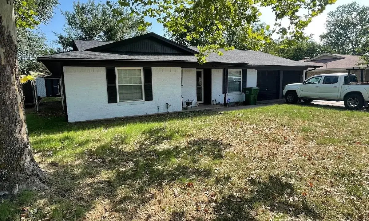 Professional roofing crew working on a residential roof in Pacific